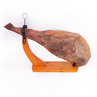 Ham on classic yellow wooden ham holder